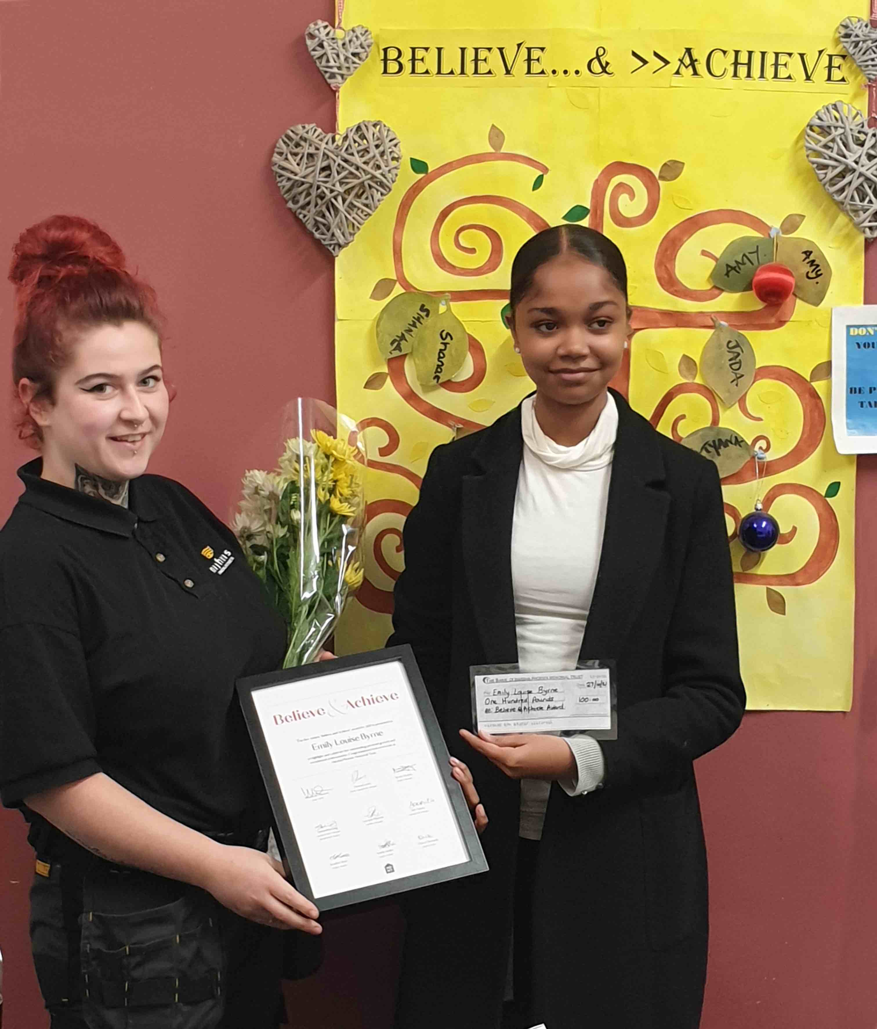 Diana and Emily receiving the award